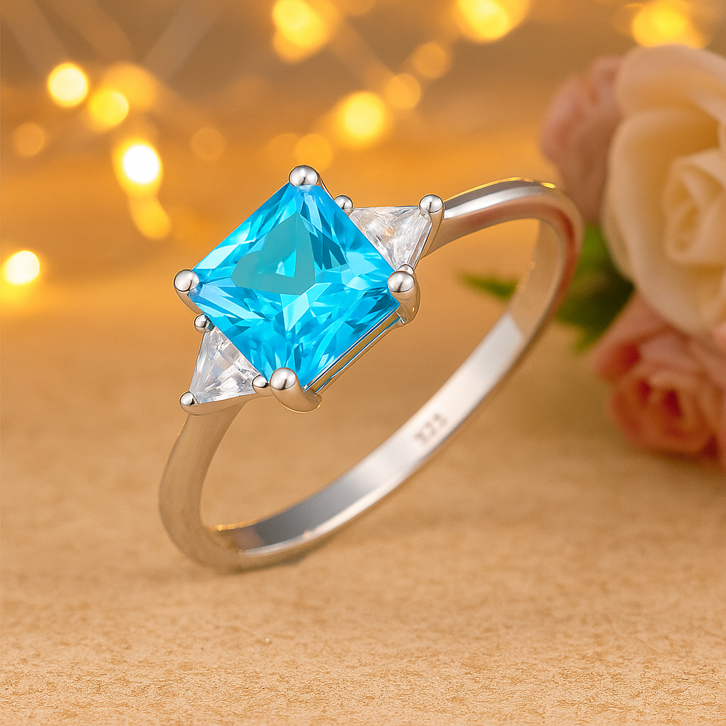 Blue Princess Cut Ring with Sparkling Side Stones