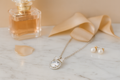 925 Silver Bow Halo Pendant Necklace for Women – Elegant Round CZ Solitaire with Twin Triangle Design