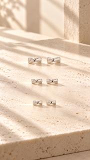 Polished Crisscross Ribbon Stud Earrings Set – 3 Sizes - Aaryahi Silver jewellery product photo
